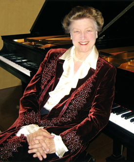 Portrait of Louise Barfield at the piano.